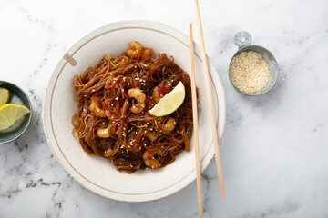 Traditional noodles with shrimps and lime