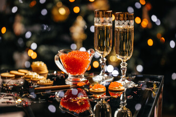 glass of champagne with red caviar appetizer cracker, butter and red caviar. banner, menu, recipe. selective focus, place for text