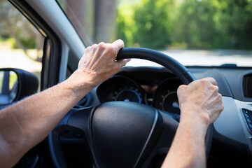 Car driving background. Steering wheel with driver's hands