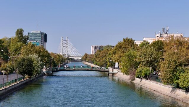 Aerial View Over Dambovita River In Regie District With Ciurel Bridge In The Background, Bucharest, Romania