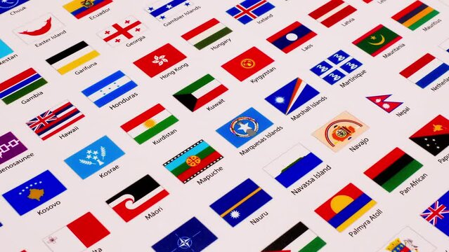 Close-up and zooming out of a picture of various flags of countries, states, agencies, and tribes all from all over the world.