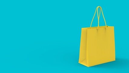 shopping paper bag on the turquoise blue background. flat lay photo of yellow bag. summer sale concept with copy space