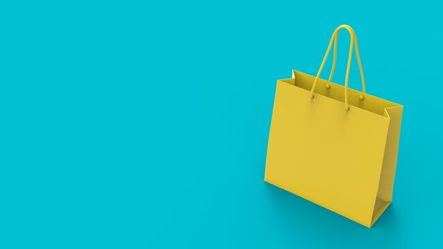 Shopping Paper Bag On The Turquoise Blue Background. Flat Lay Photo Of Yellow Bag. Summer Sale Concept With Copy Space