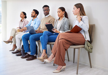 Business people, row and technology for interview, recruitment or hiring process in waiting room. Men, women and group together for career, onboarding or opportunity at company with diversity or web - obrazy, fototapety, plakaty