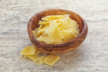 Sliced parmesan cheese heap in the bowl