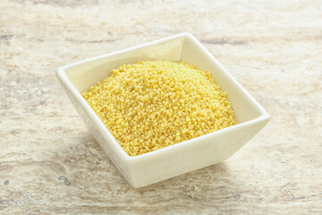 Raw couscous in the bowl