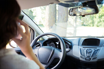 Car driving background. Steering wheel with driver's hands