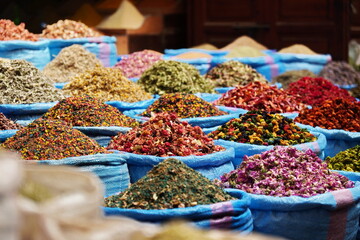 different spices in blue sacks in Marrakesh, Morocco