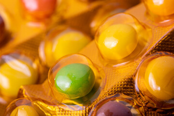 Medicinal drug pills capsules in blister close-up. Macro photo