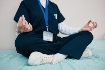 Doctor, yoga and meditate to relax in hospital, healing and break from work, closeup in calm for...
