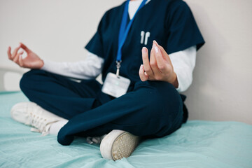 Doctor, healing and meditate to relax in hospital, yoga and break from work, closeup in calm for...