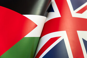 Flags of palestine, great britain. The concept of international relations between countries. The concept of an alliance or a confrontation between two state governments. Friendship of peoples. - obrazy, fototapety, plakaty
