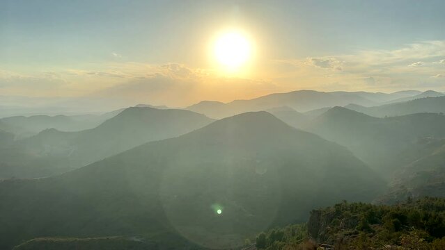 Mountains landscape on sunset. Mountain view from peak Mola De Segart mountain in Sierra Calderona national park. Sunset over Golden Hills mountains. Landscape of a mountain valley. Hiking in mountain