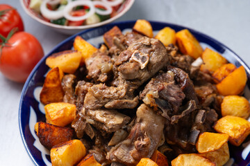 grilled lamb with fried potato, oriental cuisine, asian cuisine, traditional oriental dish 