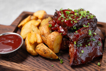 grilled meat with potato and sauce on wood board close up, Fine dining in the restaurant