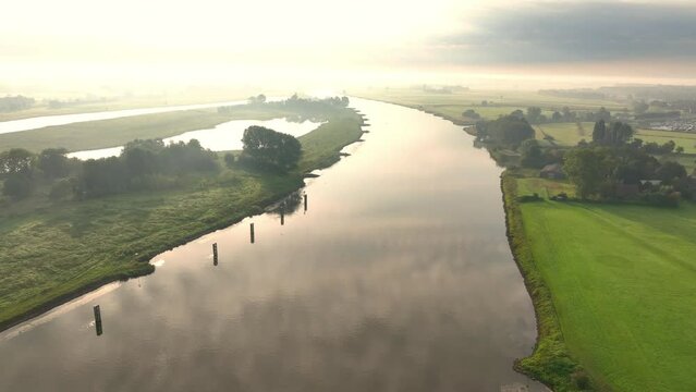 Aerial view over the IJsseldelta and the river IJssel during a summer sunrise near Zwolle and Hattem in Overijssel and Gelderland Netherlands.