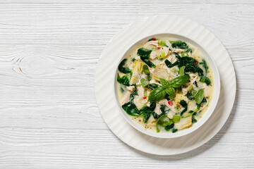 chicken spinach artichoke creamy soup in a bowl