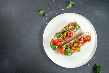 Tomato and cheese fresh made bruschetta. Italian tapas, antipasti with vegetables. banner, menu, recipe place for text, top view