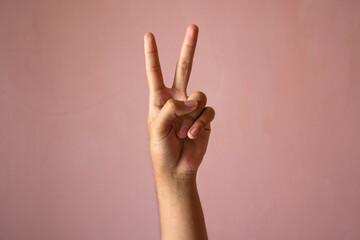 A Hand shows a victory sign