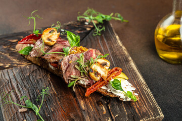 Steak sandwich with vegetables on a wooden board, Restaurant menu, dieting, cookbook recipe top view