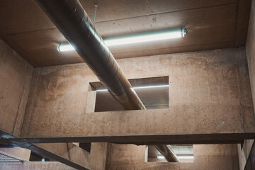 Futuristic industrial interior of modern building - lighting behind the metal pipe - utopian ceiling