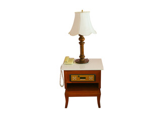 Old stylish lamp, desk phone on bedside table wood brown indoors isolated on cut out PNG. Bedroom...