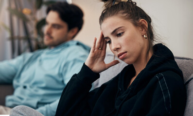 Frustrated couple, headache and fight on sofa in divorce, disagreement or conflict in living room...