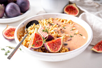 Healthy breakfast bowl with granola and figs