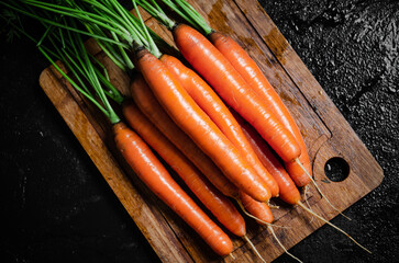 Carrots on a cutting board.
