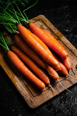 Carrots on a cutting board.