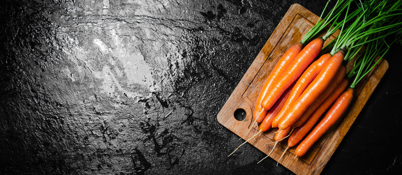 Carrots on a cutting board.