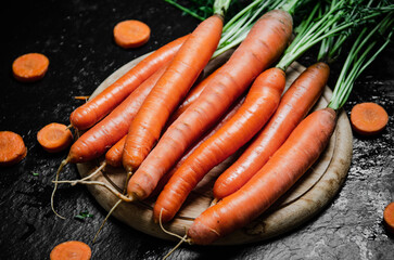 Carrots on a cutting board.