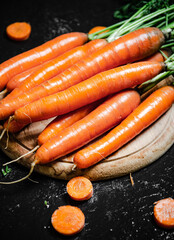 Carrots on a cutting board.