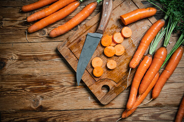 Fresh chopped carrots on cutting board. - 660984906