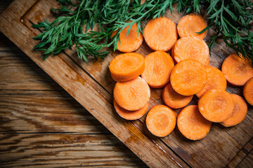 Fresh chopped carrots on cutting board.