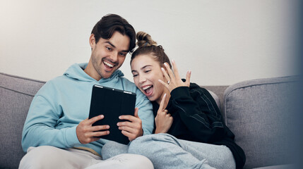 Man, woman and video call for engagement ring with happiness on sofa in living room of home....