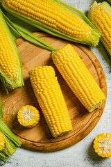 Fresh corn on light table.