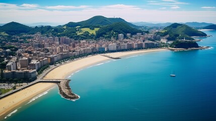 Aerial view of Donostia, a coastal city in the Basque Country, bathed in sunlight, with high-rise residential buildings overlooking the beautiful blue waters of the Bay of Biscay