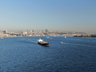 Aerial front view Container cargo ship full carrier container with terminal commercial port background for business logistics, import export, shipping or freight transportation.