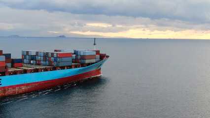 Aerial view of freight ship with cargo containers.