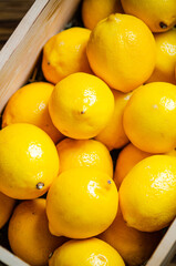 Fresh lemons. On wooden table.