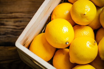 Fresh lemons. On wooden table.