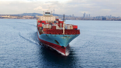 Aerial view of freight ship with cargo containers.