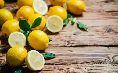 Fresh lemons. On wooden table.