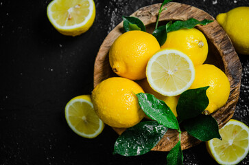Fresh lemons. On black table.