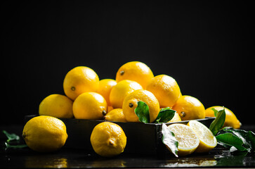 Fresh lemons. On black table.