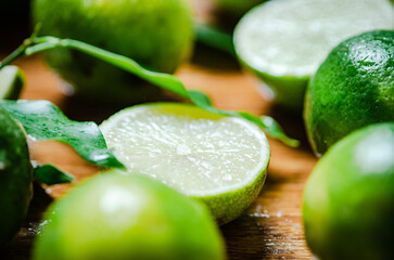 Fresh limes. On wooden table.
