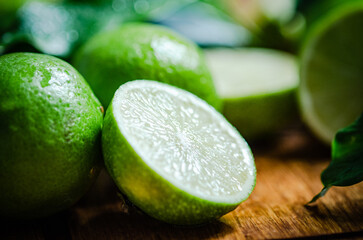 Fresh limes. On wooden table.