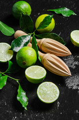 Fresh limes. On black table.