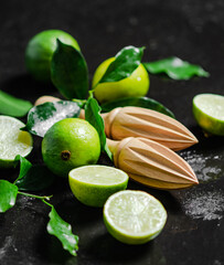 Fresh limes. On black table.